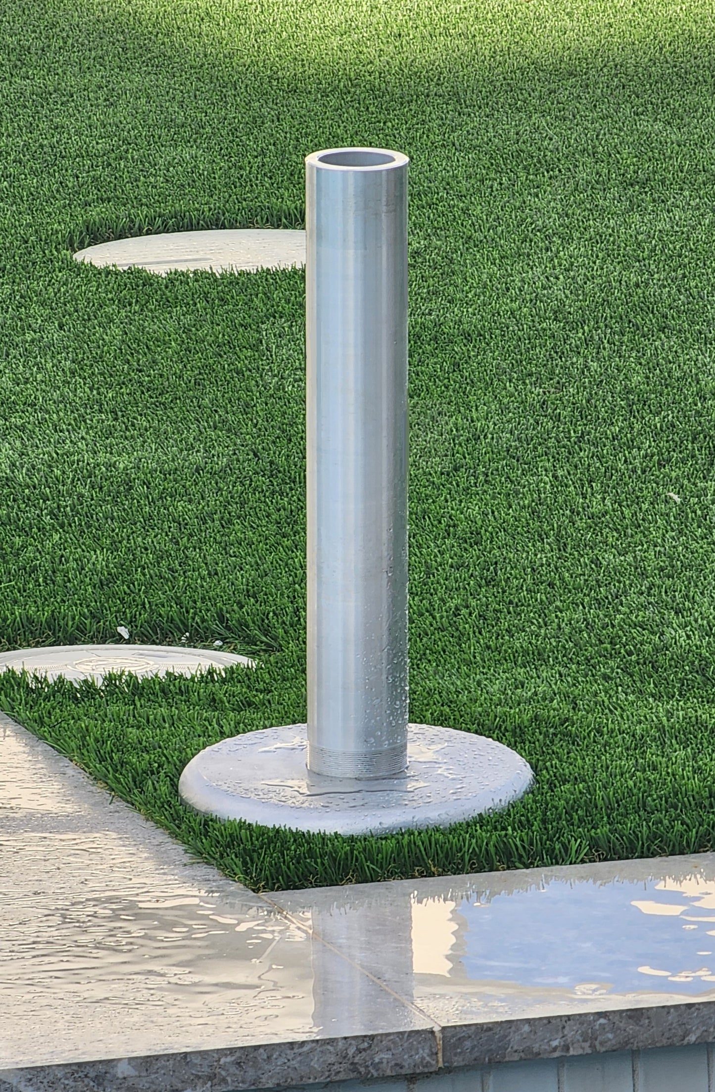BAJAMATE aluminum in-deck and patio umbrella sleeve adapter, available in 18" and 26" sizes, heavy-duty billet aluminum design for Baja shelves, sun shelves, and pool decks. Durable, corrosion-resistant, and engineered to support umbrellas, tables, and poolside accessories with a secure fit.