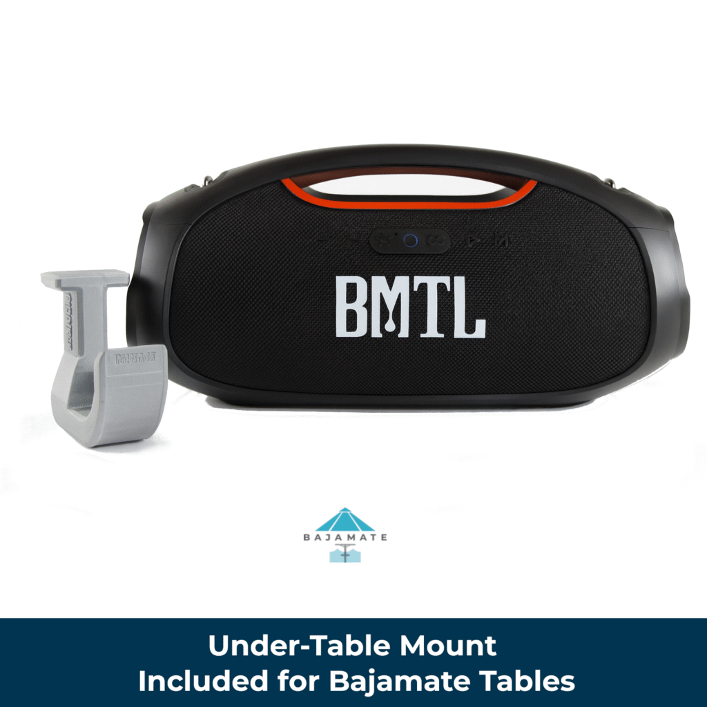 BMTL portable pool Bluetooth speaker mounted on a Bajamate under-table bracket—shows the included 3D-printed hook that attaches to the BajaMate table and supports the speaker by its handle.