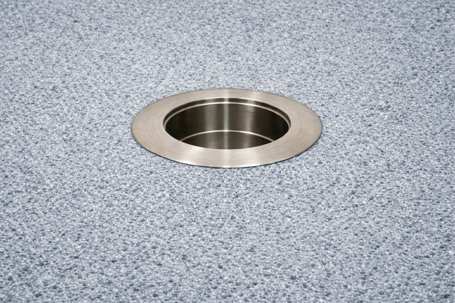 316 stainless steel in-pool umbrella sleeve with threadless cap installed in pool floor background.