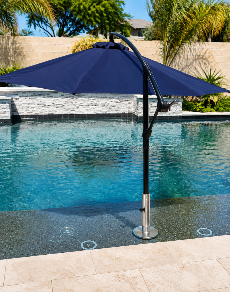 Prototype BajaMate umbrella adapter installed on a Baja shelf with a large navy cantilever umbrella