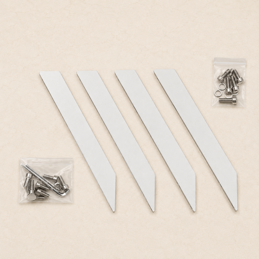 Four BajaMate aluminum table legs with replacement bolts, washers, and Allen keys on a light stone background.